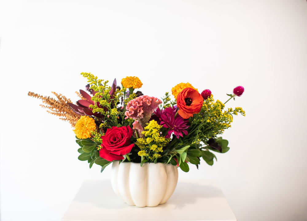 Colorful floral arrangement in a  white pumpkin-shaped vase Kansas City delivery Thanksgiving Fall flowers