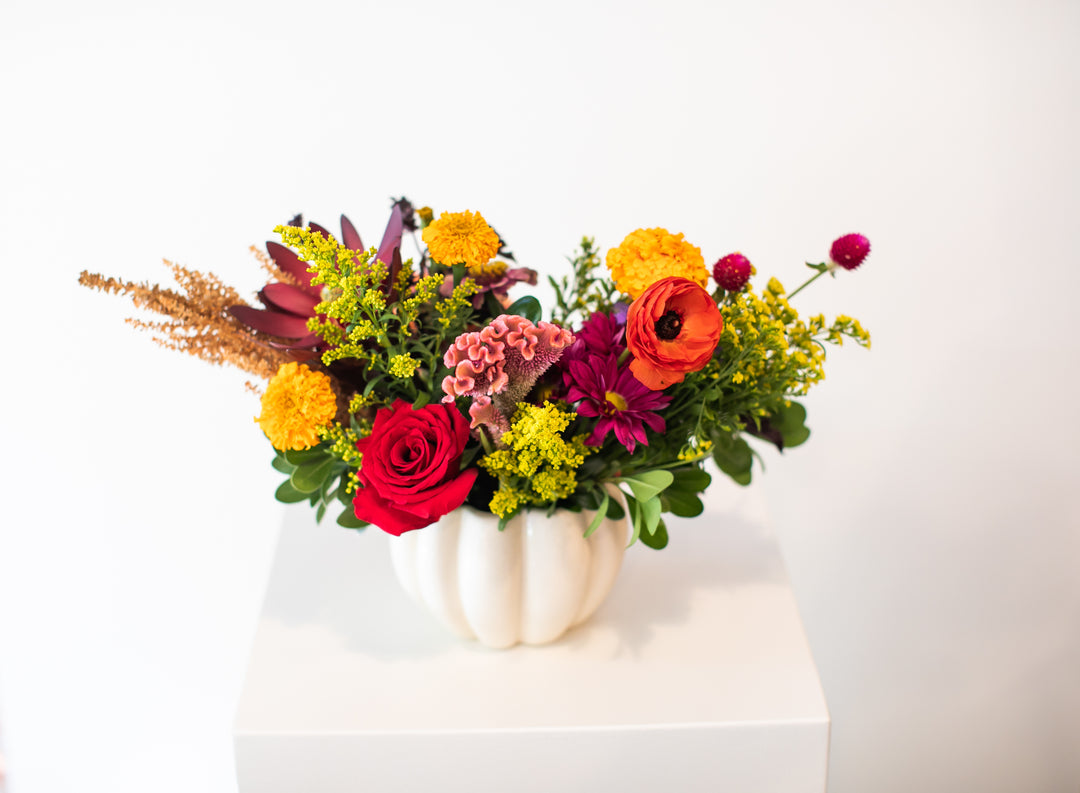 Colorful floral arrangement in a  white pumpkin-shaped vase Kansas City delivery Thanksgiving Fall flowers