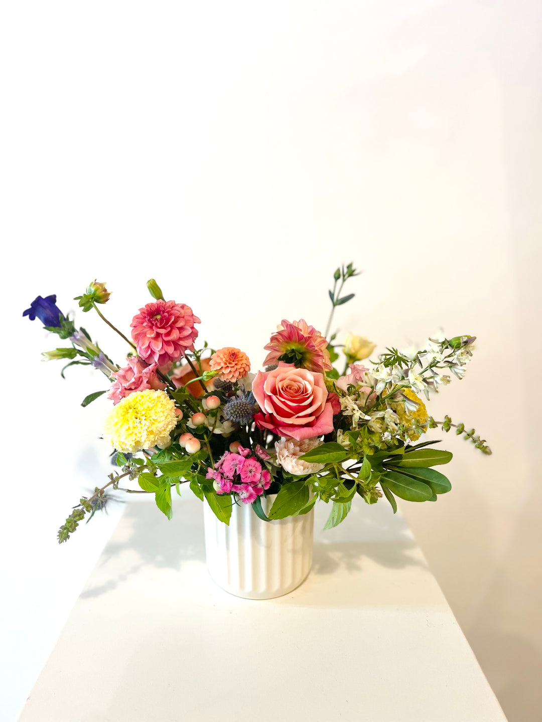 Spring florals in cream beam vase Lee's Summit Bel Fiore Co. flower shop