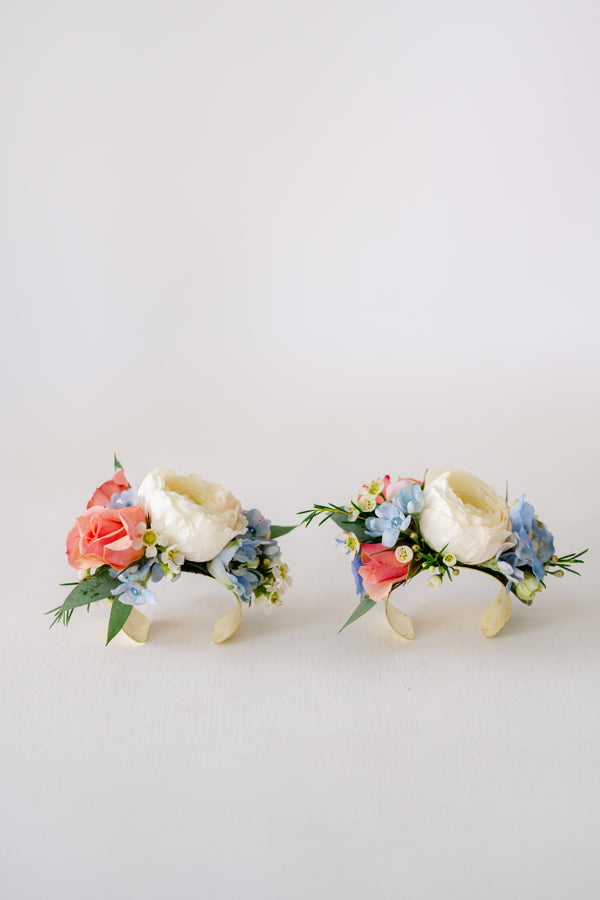 Corsage Lee's Summit Florist  Homecoming. Soft pinks, whites, blue wrist corsage on gold cuff