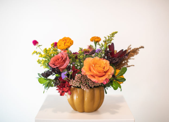 Colorful floral arrangement in a pumpkin-shaped vase Kansas City delivery Thanksgiving Fall flowers