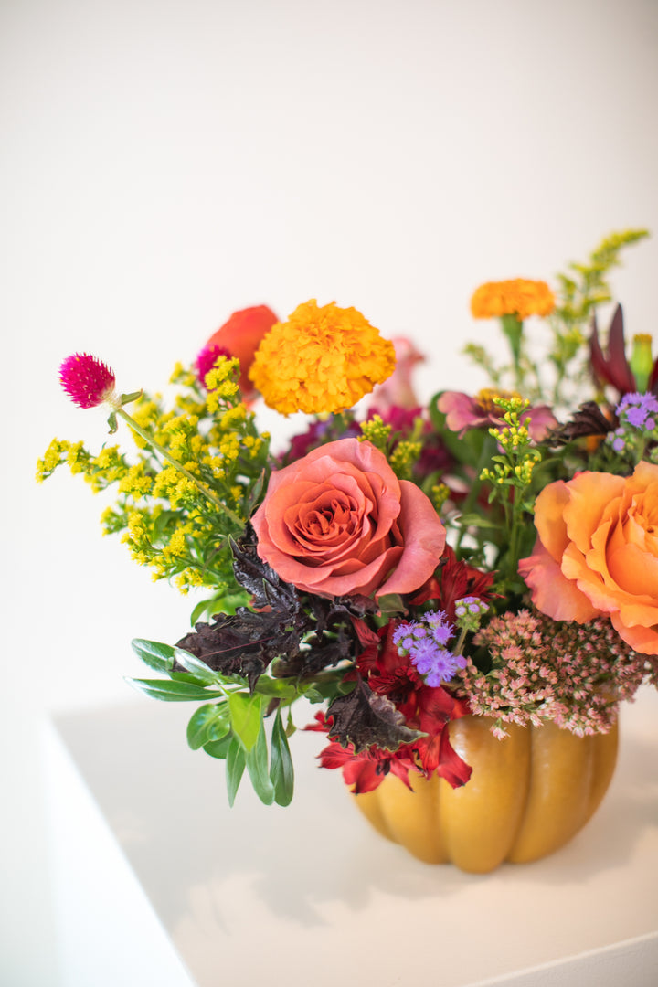 Colorful floral arrangement in a pumpkin-shaped vase Kansas City delivery Thanksgiving Fall flowers