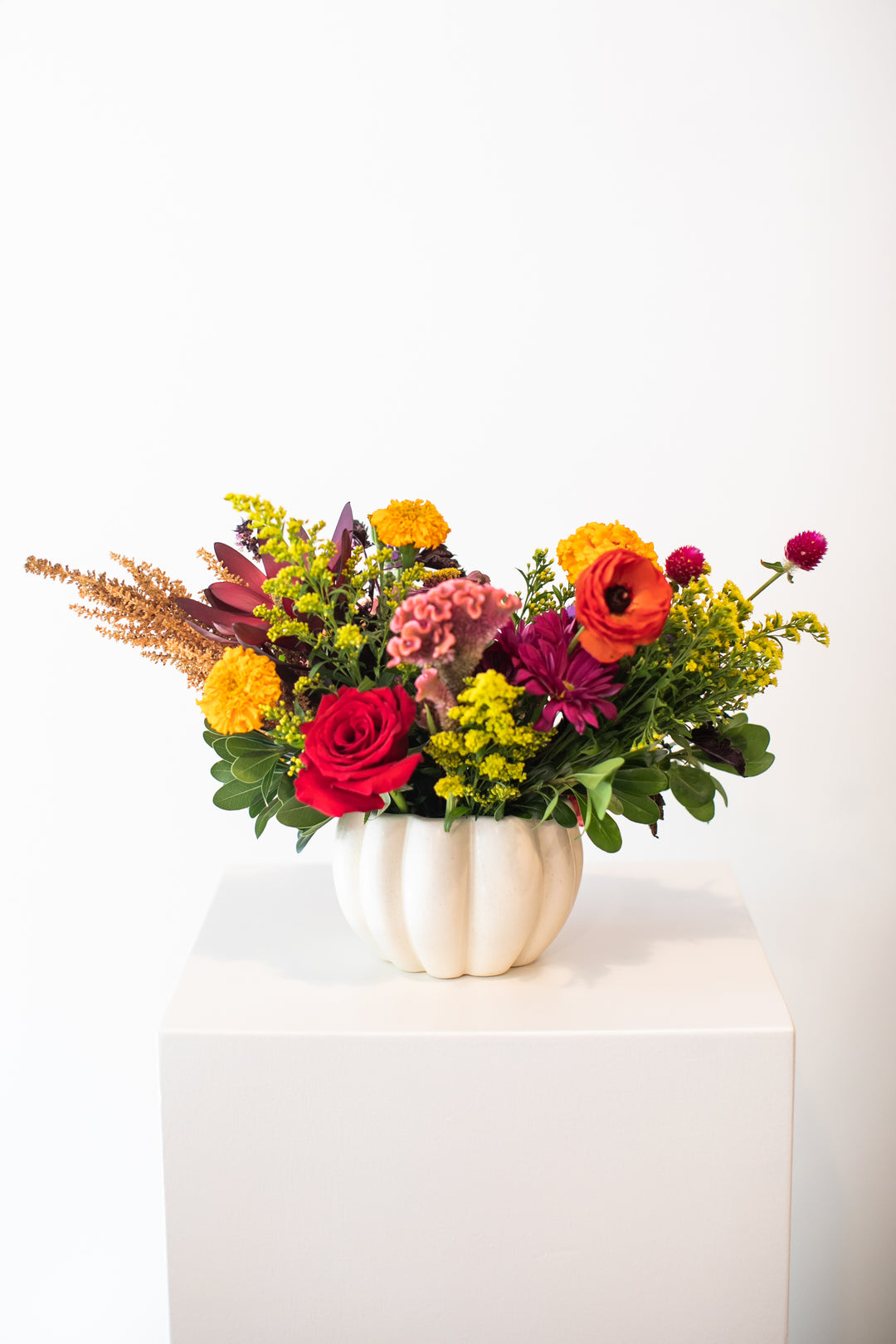 Colorful floral arrangement in a  white pumpkin-shaped vase Kansas City delivery Thanksgiving Fall flowers