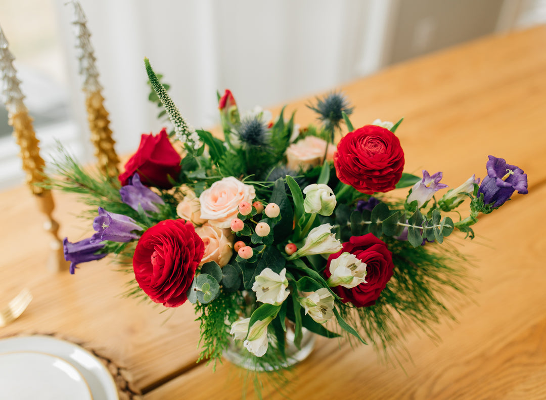 Grand Holiday Christmas arrangement roses and evergreens Kansas City Florist 